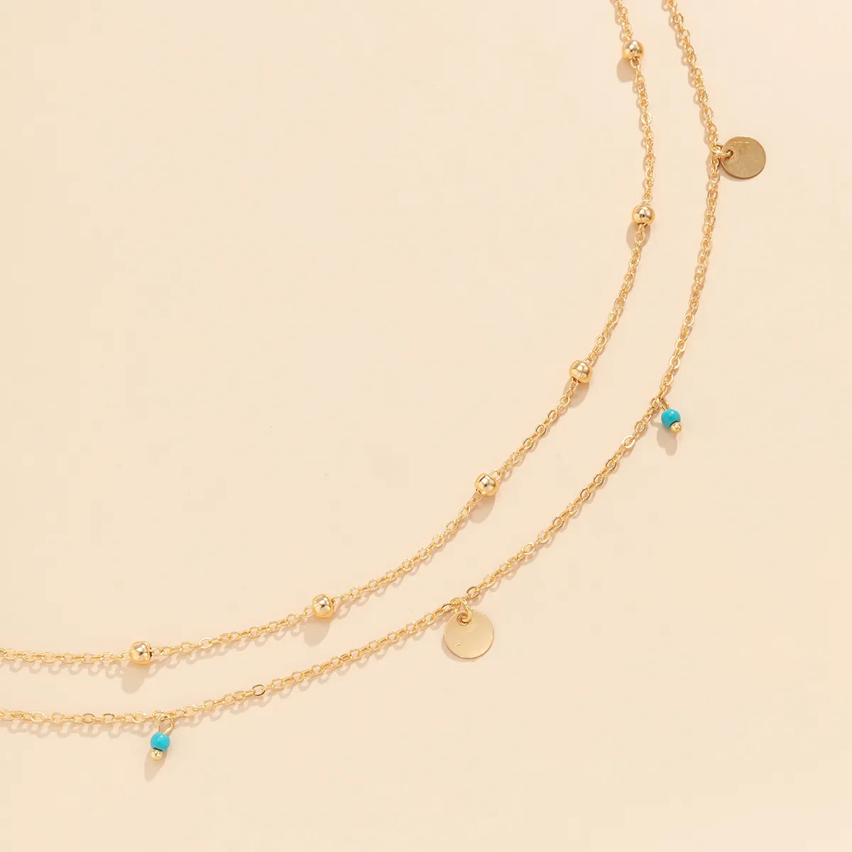 Double-Layered Gold Waist Chain with Disc & Turquoise Charms